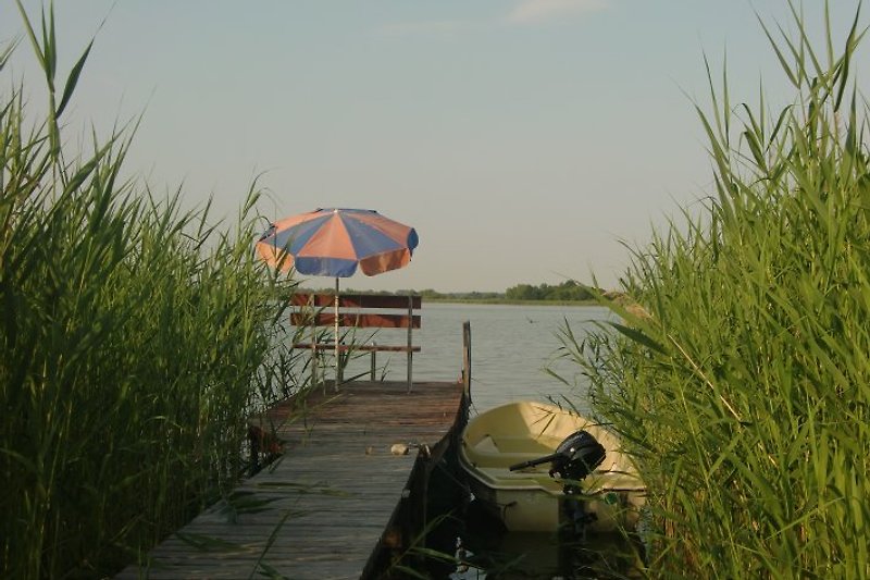 A rowing boat is available for you at the jetty, which can optionally be equipped with an outboard motor.