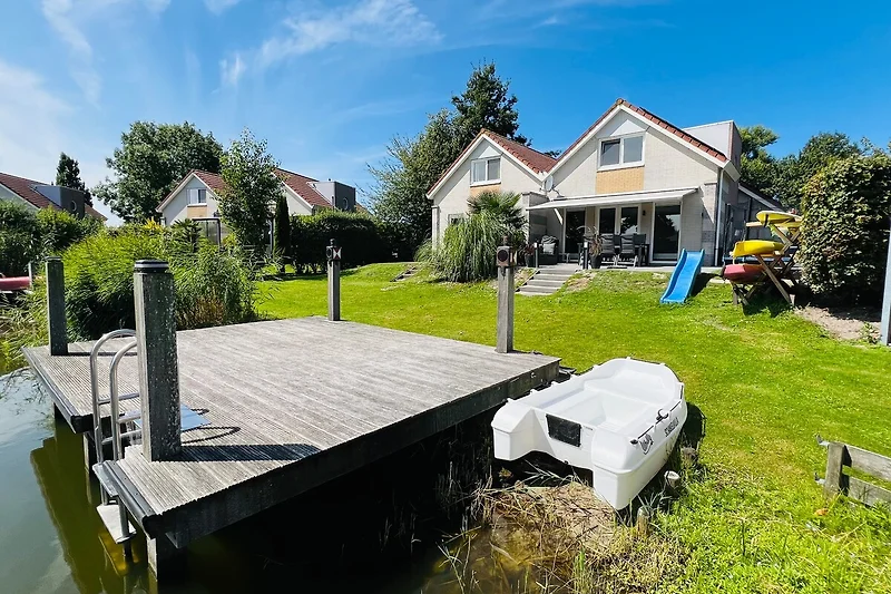 Dock and wooden deck by the water for easy moments.