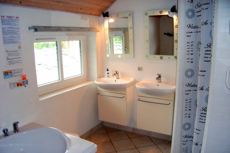 Large bathroom with whirlpool, sauna and shower.