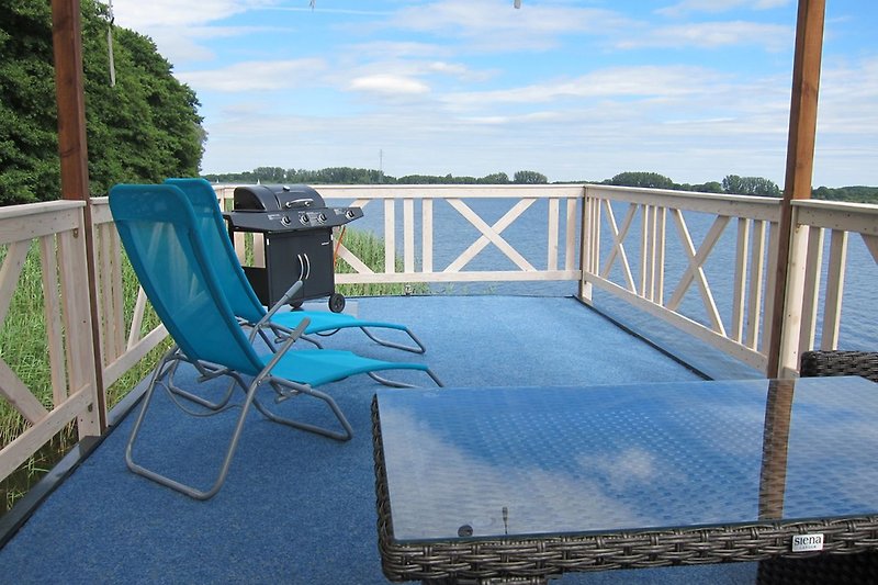Sun deck with sun loungers and grill