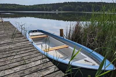 Meerzicht huis met steiger en boot