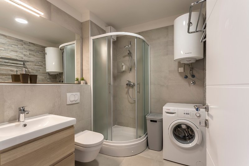 Luxury apartment - bathroom with washing machine