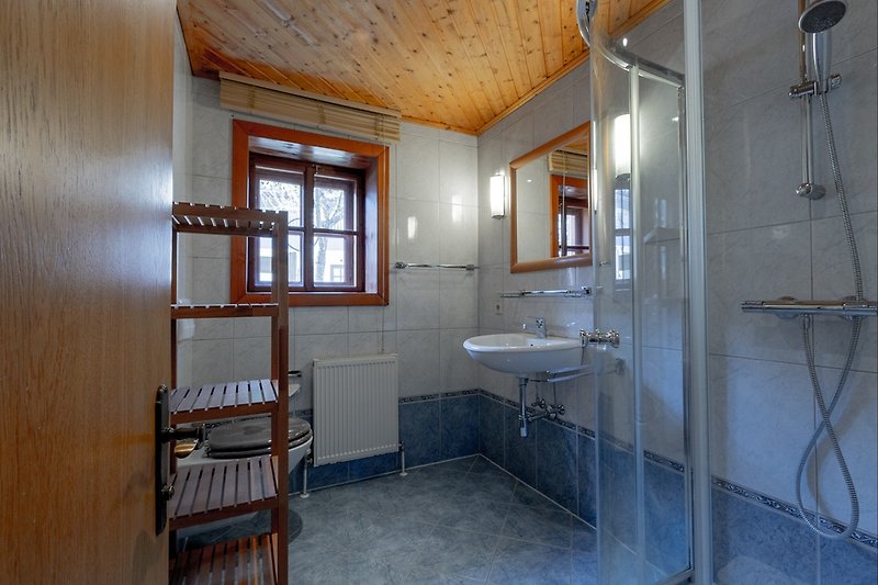 Ground floor: bathroom with shower, sink, toilet