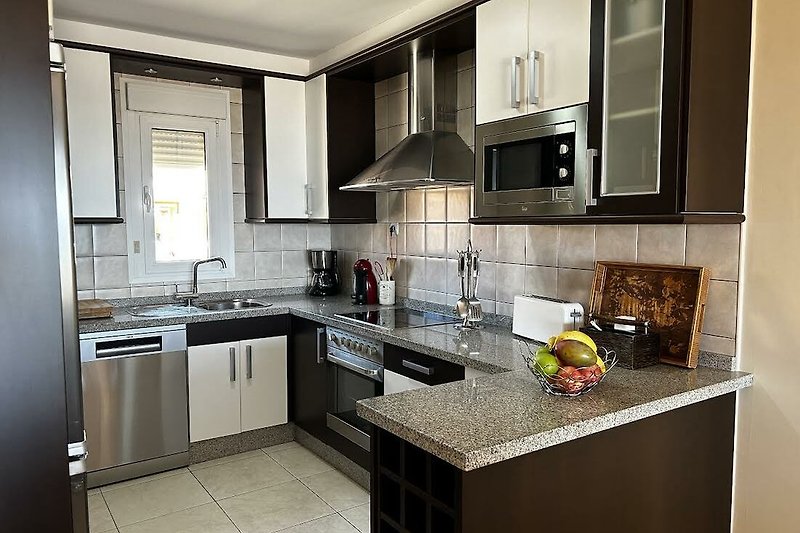 Comfortable, bright and equipped kitchen