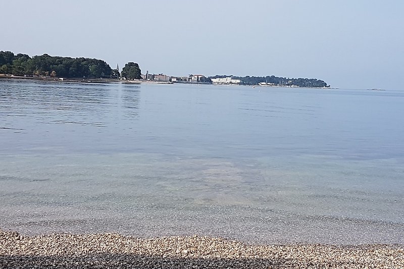 Porec town and St. Nikola island view from Laguna beach