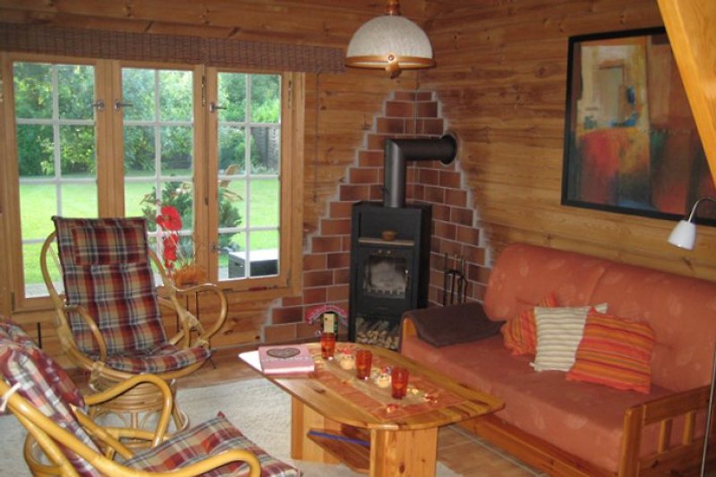 Living area with wood stove. Direct access to the garden.