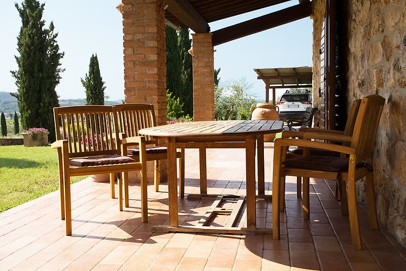Cosy veranda with dining table