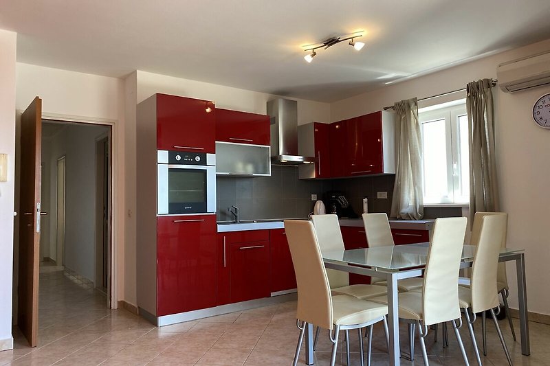 Stylish furniture and a well-designed kitchen with modern appliances.