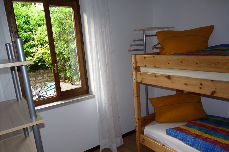 The small bedroom with bunk bed.