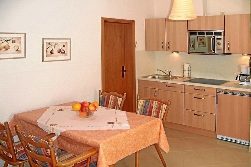 Modern fitted kitchen and dining table