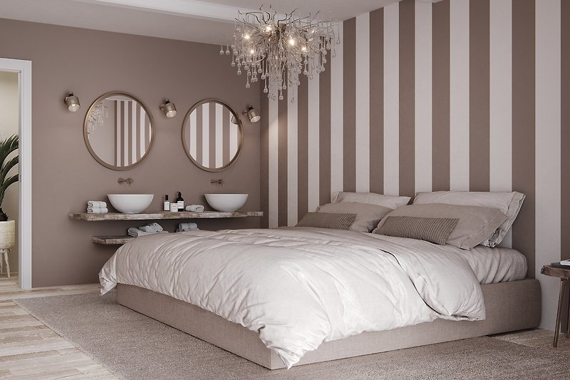 Schlafzimmer mit bequemem Bett, stilvoller Einrichtung und gemütlicher Beleuchtung.