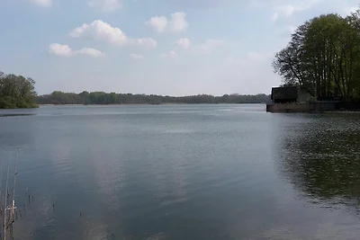 Vakantiebungalow met uitzicht op het meer en boot
