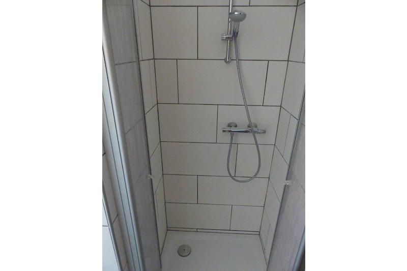 Partial view of a bright shower room