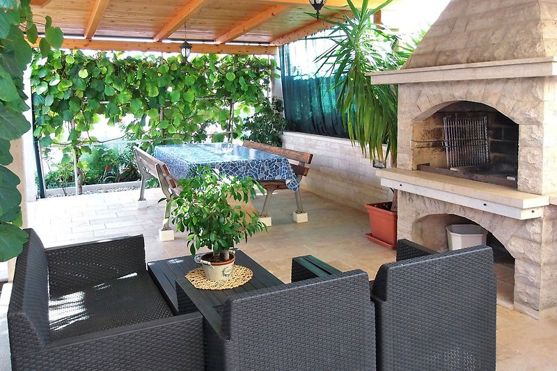 Terrace in garden with grill