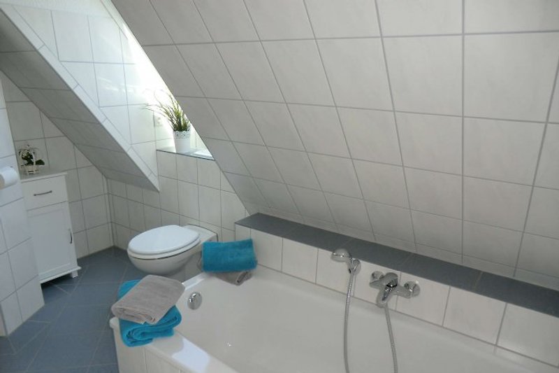 Modern bathroom with bathtub.