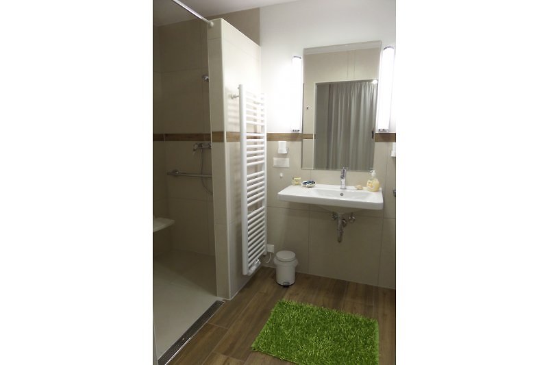 Spacious shower area with folding seat