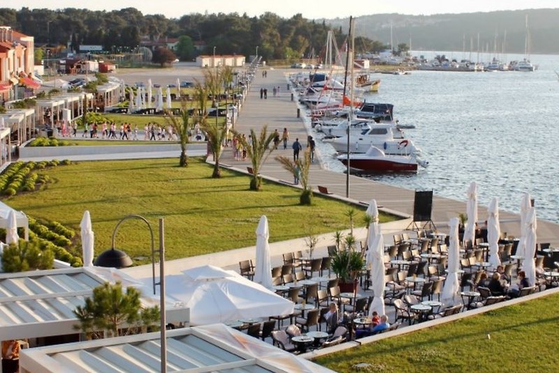 Beautiful promenade at the city Harbor with shops, restaurants and bars