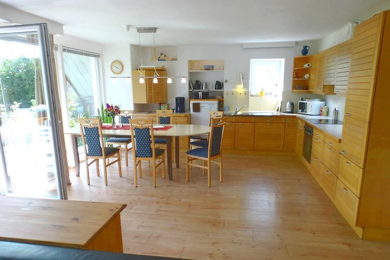 livingroom of the lower appt, the kitchen and table is suitable for 12 persons .