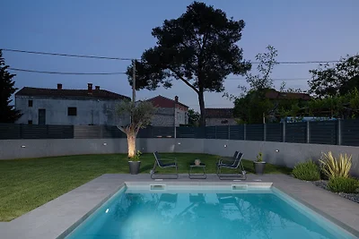 Modern villa with pool in a small p