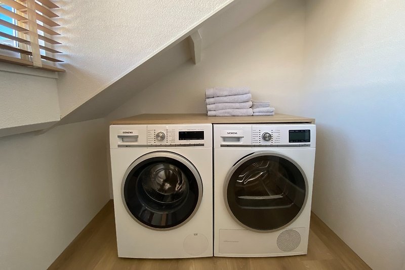 Washing machine and tumble dryer. Washing machine has automatic dosing. You don't need to bring detergent.