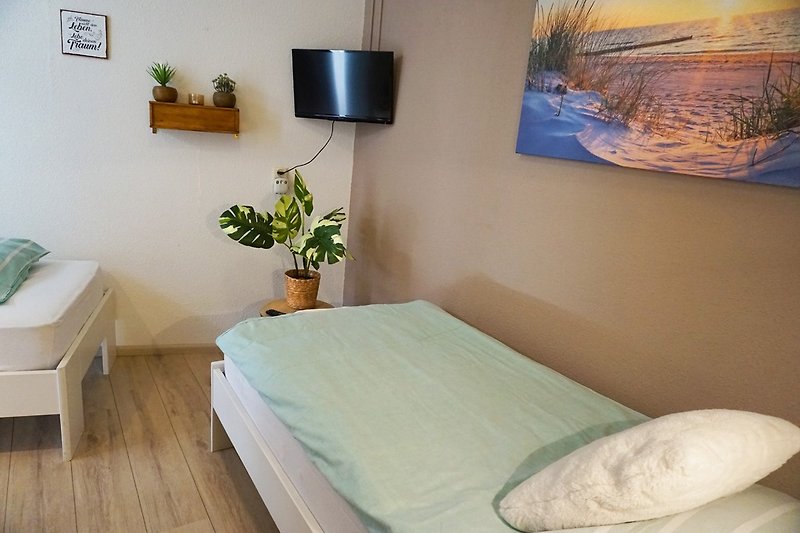 Schlafzimmer mit zwei Einzelbetten