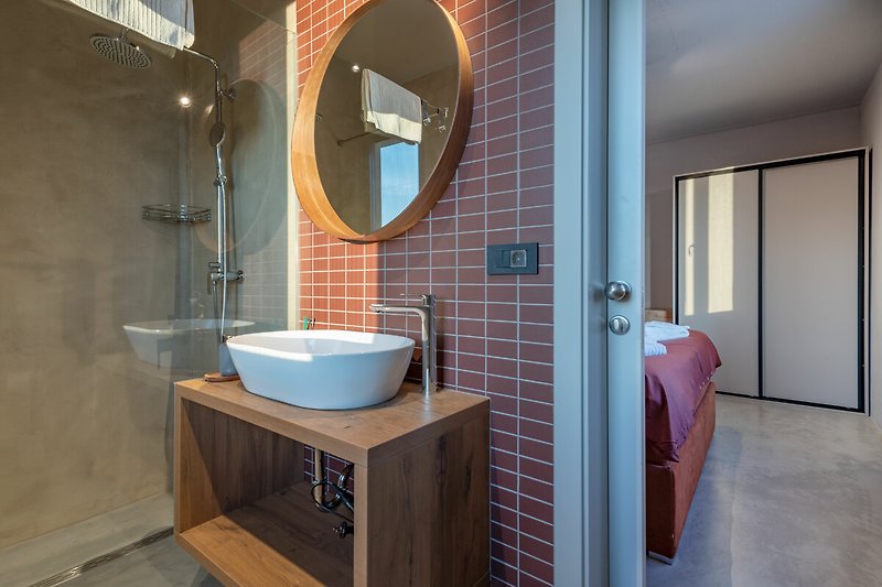 Die Badezimmer sind modern und mit allen Annehmlichkeiten ausgestattet, die Sie benötigen