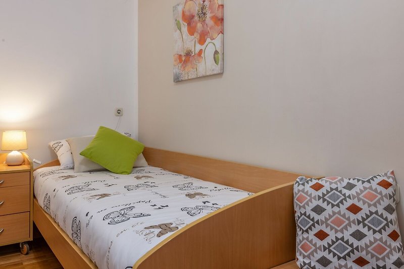 Gemütlichkeit und Komfort in dem schön gestalteten Schlafzimmer der Villa Tupljak.