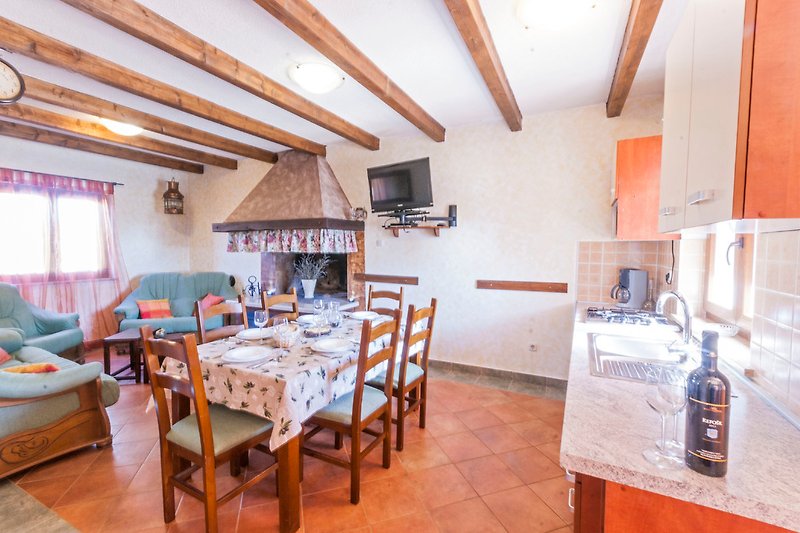 Kitchen, living room and dining room.