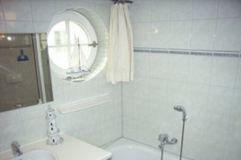 Bathroom with bathtub and separate shower.