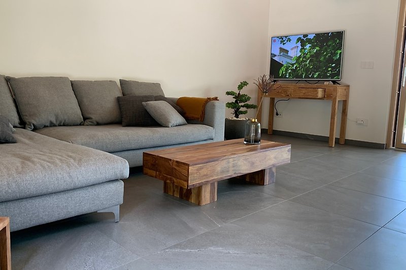 PIGNA - Living mit bequemer Couch und TV