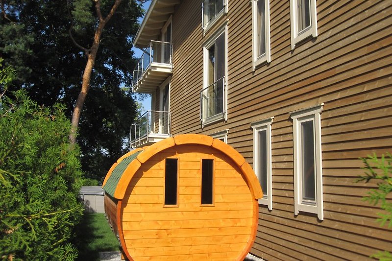 Their barrel sauna in the garden