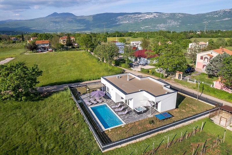 Rent this stylish property with a stunning mountain view and beautiful landscaping.