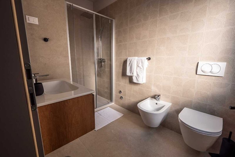 Stylish bathroom with modern fixtures and a sleek sink.