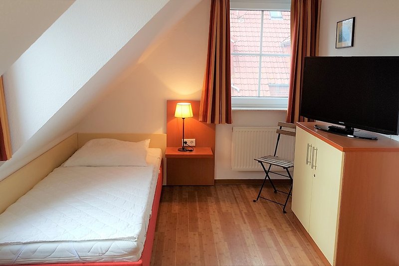 Dormitorio en planta alta con camas separadas