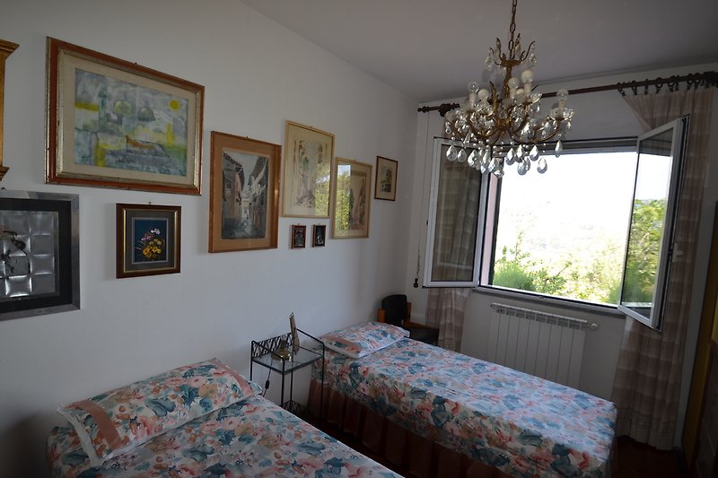 Schlafzimmer mit zwei Einzelbetten Villa Masala