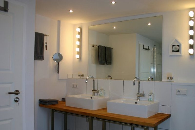 Sunlit bathroom with 2 sinks