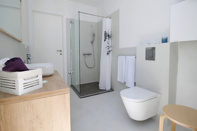 One of three en-suite bathrooms with shower and direct exit outside 