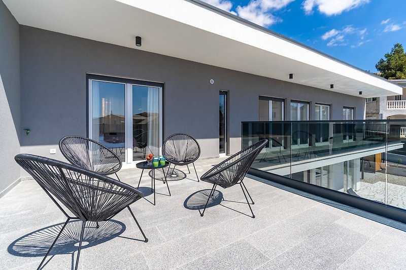 A terrace with sea views and with outdoor furniture