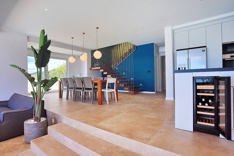 Very modern living area with a wonderful sea view and exit to the pool area