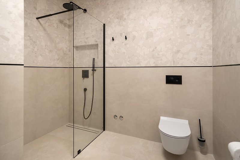 En-suite bathroom with a shower, towels are provided
