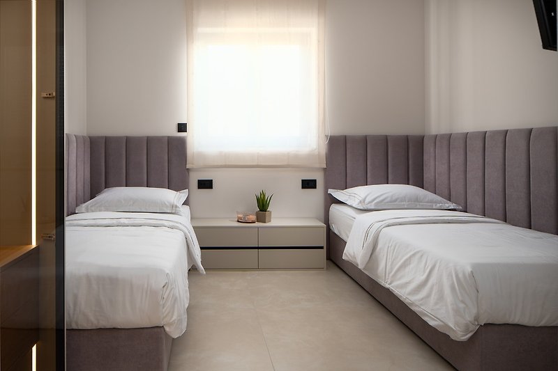 Bedroom No4 is located on the upper ground floor and offers two single beds 90cmx 200cm