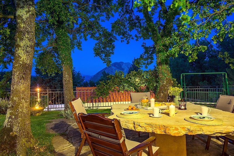 Outdoor dining area with nicely organized lights for relaxing and cozy evenings