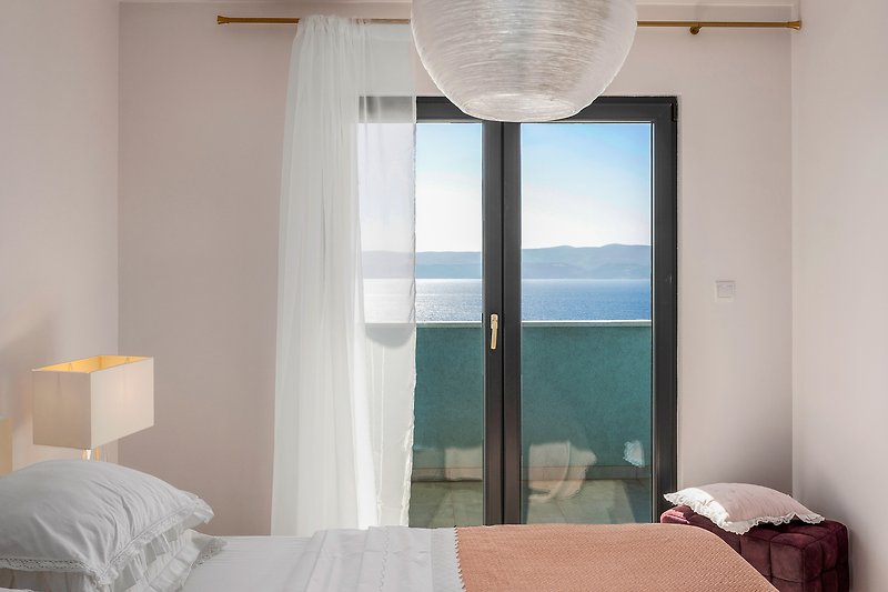 Bedroom No. 3 with double bed and exit to the terrace with sea views