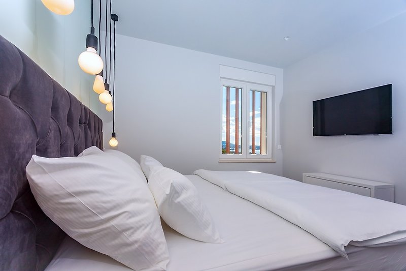 Die Betten im Schlafzimmer Nr. 5 können mit einem Kingsize-Bett verbunden werden.