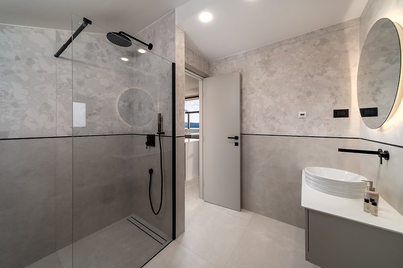 Bathroom with a shower, towels are provided