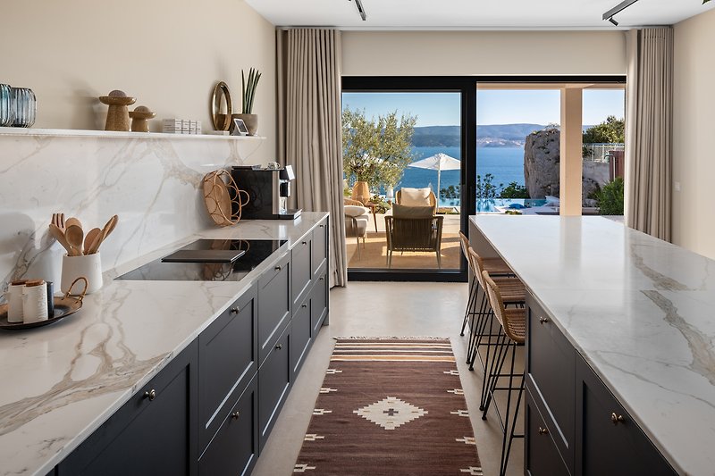 A fully equipped kitchen with a beautiful view of the Adriatic Sea