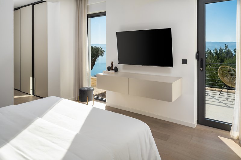 Bedroom No4 with a TV and an A/C, sea views