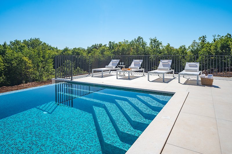 With 8 inviting deck chairs and a spacious sun deck area, you can bask in the sun or simply unwind in style