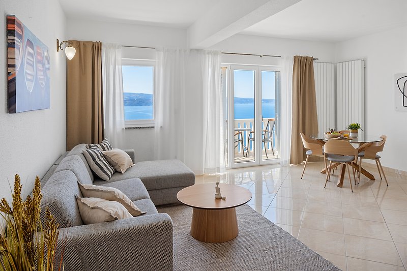 Apartment No.3 on the 2nd floor offers a fully equipped kitchen, living and dining area, and an open sea view