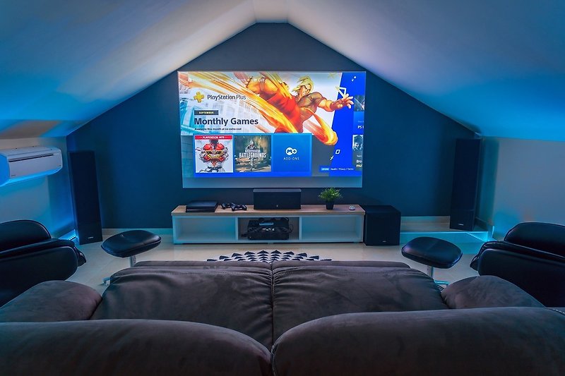 a Projector, PS4, Netflix, HBO, free WiFi, A/C, and relaxing sofas